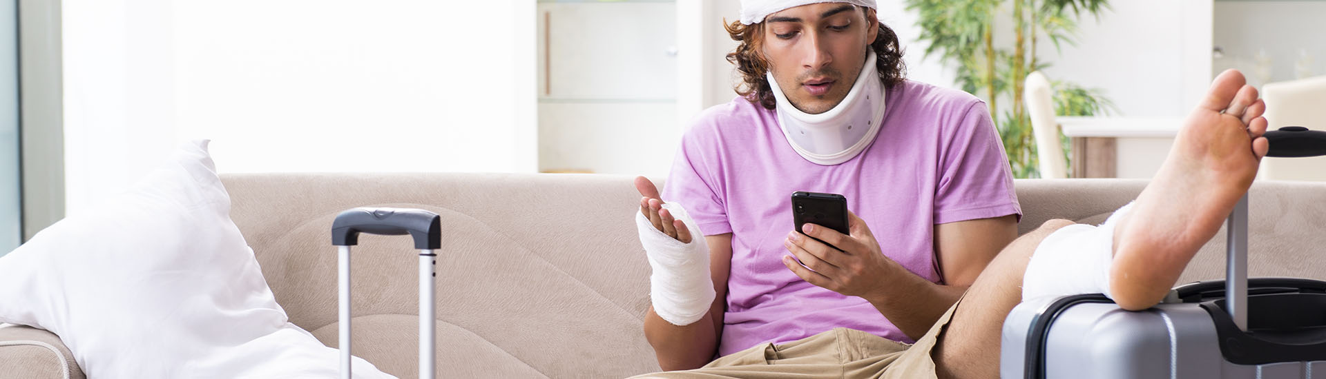 Guy with Bandages and Suitcases